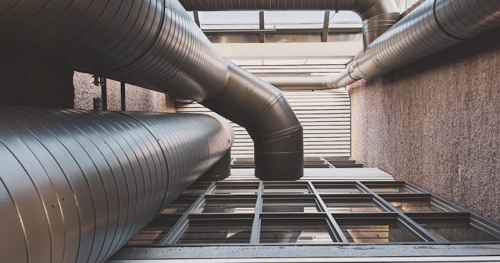 View of large HVAC ducts from below, focusing on ventilation system architecture.